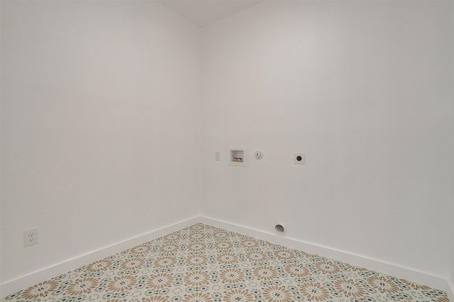 Washroom featuring hookup for an electric dryer, baseboards, and washer hookup | Image 23