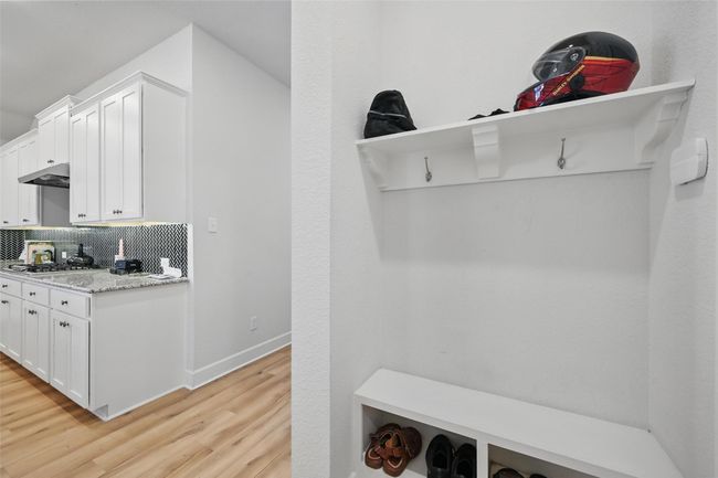 Mudroom featuring light wood-style flooring and baseboards | Image 9