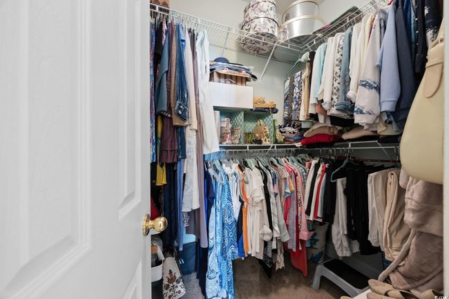 Spacious closet with carpet floors | Image 20