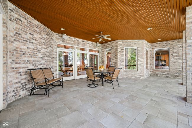 view of patio / terrace with outdoor dining space, french doors, and ceiling fan | Image 106