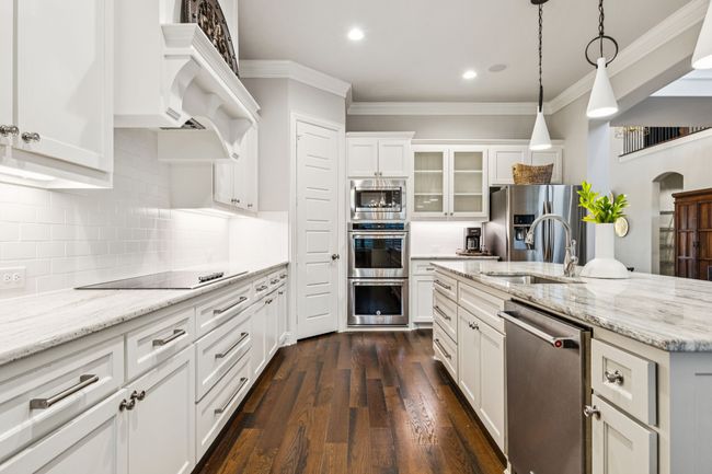Elegant upgraded hardware and glass front cabinets for personality and character | Image 16