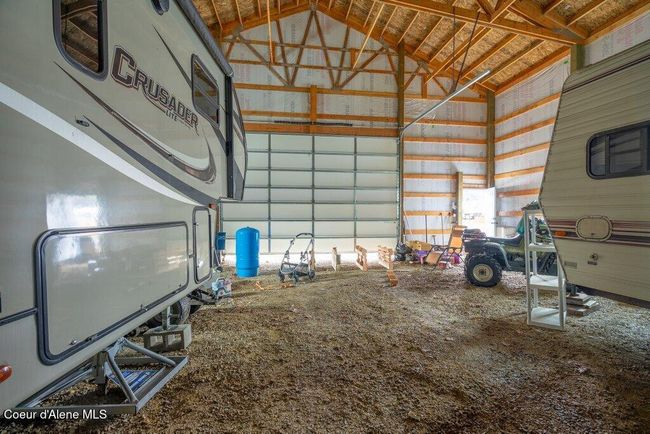 The shop has 18' walls and the well system located inside for easy access | Image 24