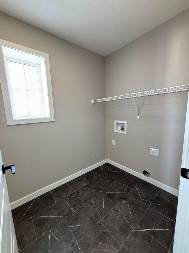 821 Reynolds Manor Sw, Home with 3 bedrooms, 3 bathrooms and 3 parking in Airdrie AB | Image 21