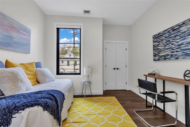 Bedroom with wood finished floors and baseboards | Image 17