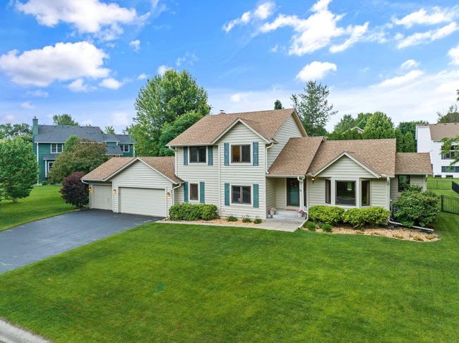 Lush front, back, and side yards. DIP your toes in your in-ground heated pool! | Image 4