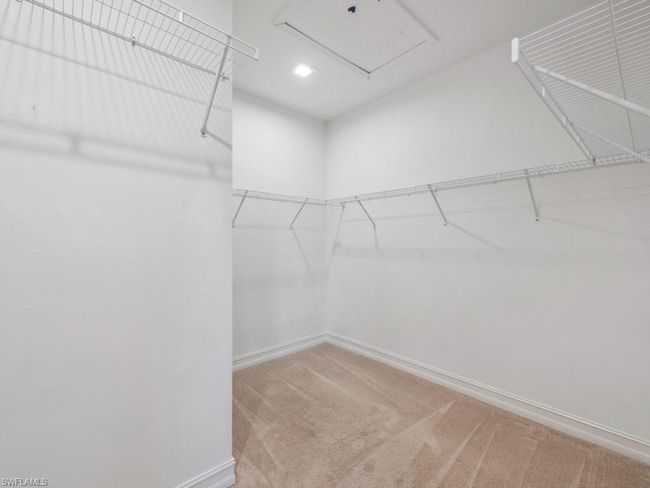 Walk in closet featuring carpet floors | Image 18