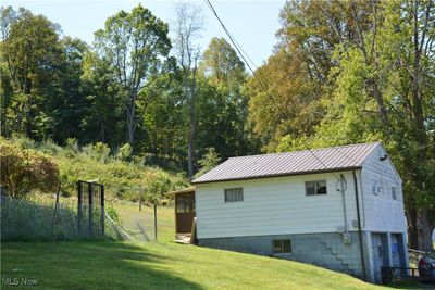 View of side of garage with a lawn | Image 3