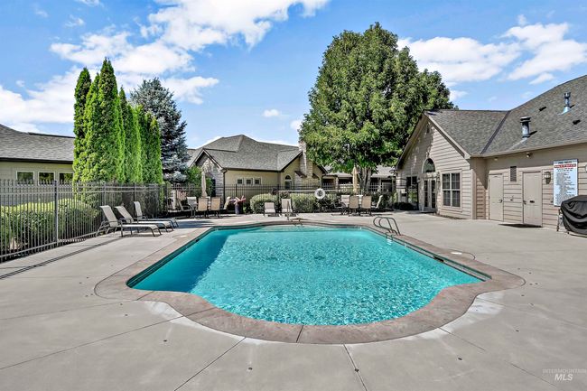 Community pool featuring a patio and a residential view | Image 28