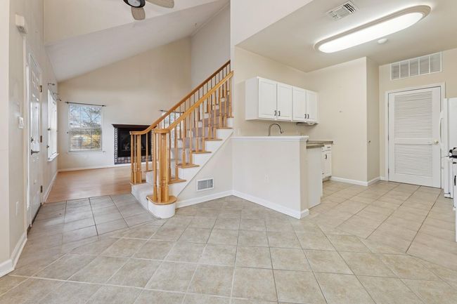 Open dining area connects kitchen to living room | Image 9