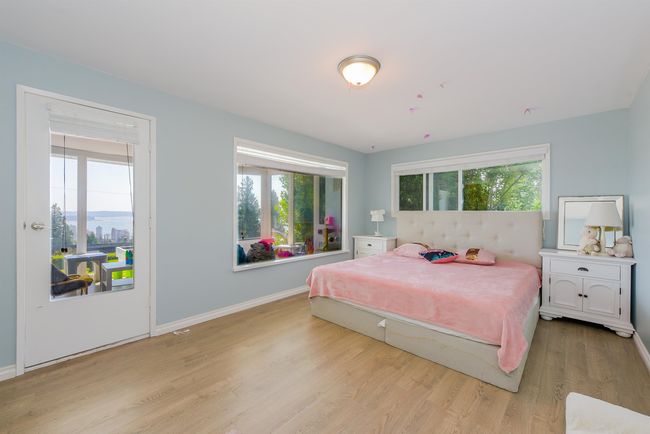 Bedroom featuring light wood-style flooring and baseboards | Image 23