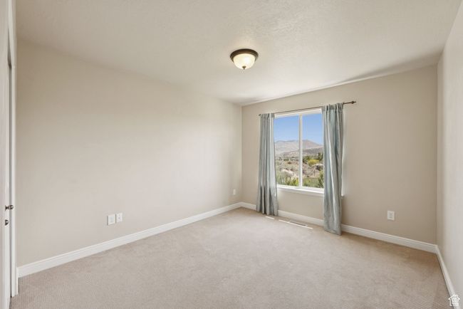 Unfurnished room with light carpet and baseboards | Image 20