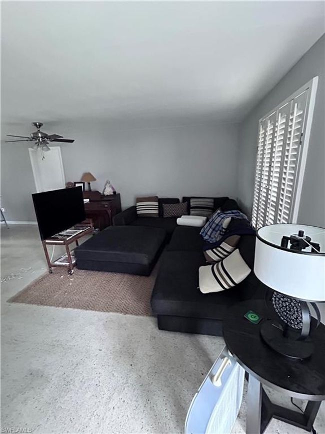 Living room featuring ceiling fan | Image 4
