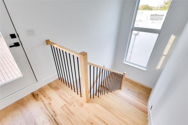 Stairs featuring wood-type flooring | Image 35