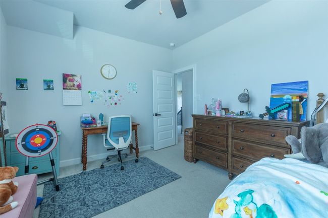Bedroom with carpet flooring and ceiling fan | Image 27