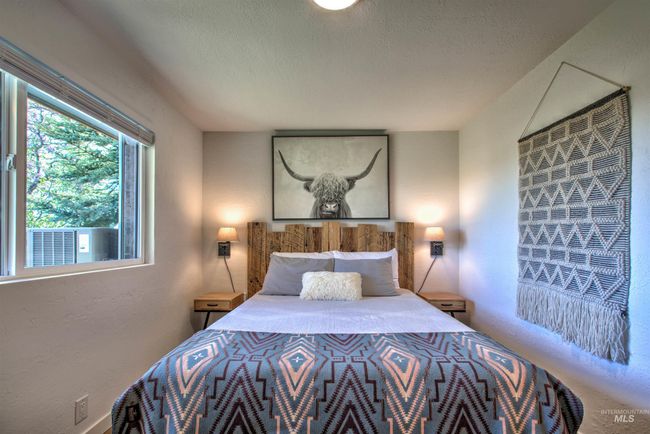 Bedroom featuring a textured wall, a textured ceiling, and cooling unit | Image 20