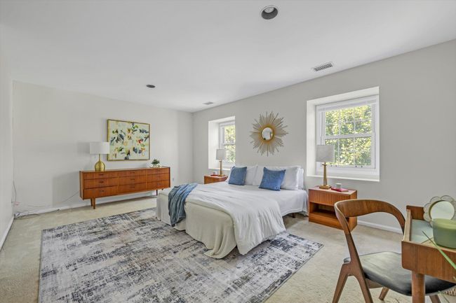 Bedroom with light colored carpet and baseboards | Image 12
