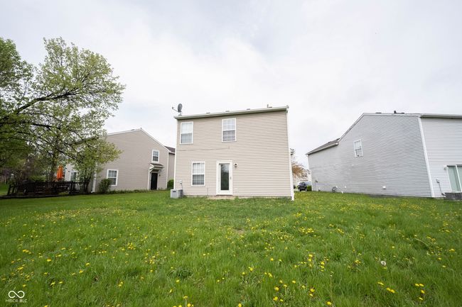 back of property featuring a yard | Image 41