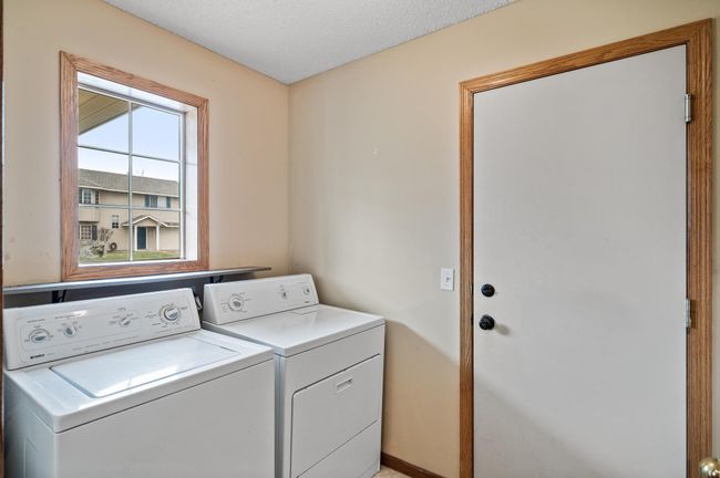 Lower Level Laundry Room With Door into Garage | Image 18