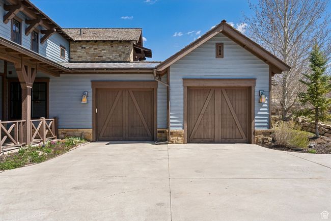 Garage featuring concrete driveway | Image 31