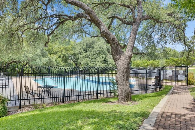Community pool with view of wooded area | Image 32