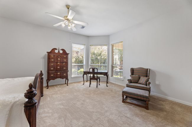 Living area with light carpet and ceiling fan | Image 27