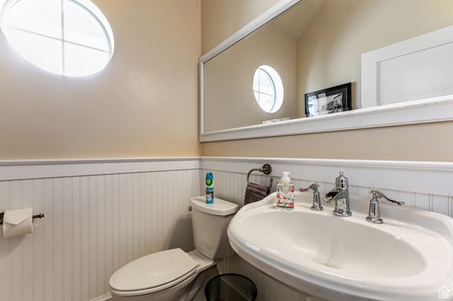 Bathroom with a sink, toilet, and wainscoting | Image 27