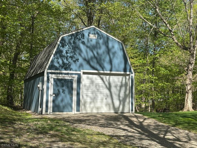 This additional detached garage measures 24 x 16 and has a cement floor. It sits on the additional back lot. | Image 7
