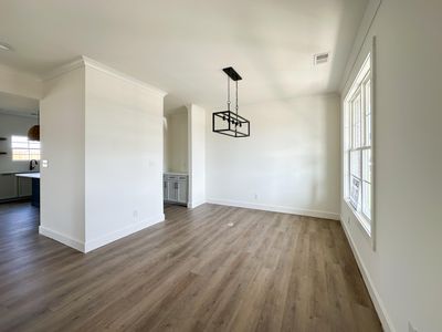 Dining room with butlers pantry leading to kitchen | Image 2