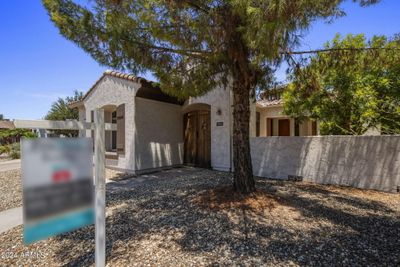 Enclosed courtyard with gate. | Image 2