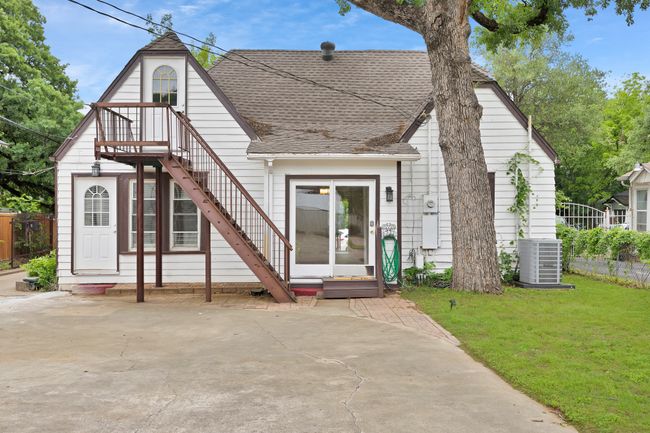 View of back of the house, and stairs that goes up to an unfinished attic area that could be easily converted into another room | Image 25