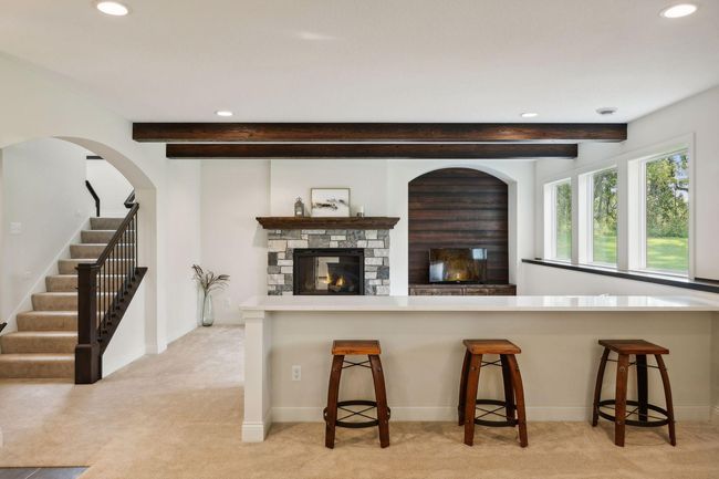 Extra seating located in Wet Bar area | Image 45