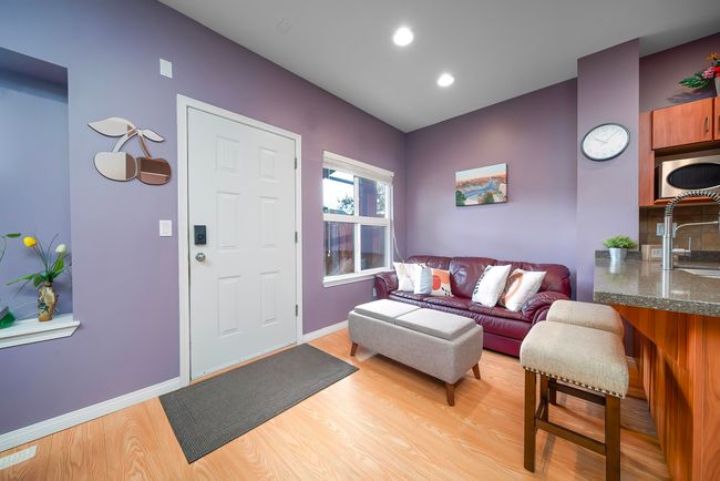 Living area with recessed lighting, baseboards, and light wood-style flooring | Image 11