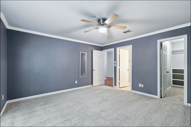 Unfurnished bedroom featuring baseboards, visible vents, and carpet | Image 18