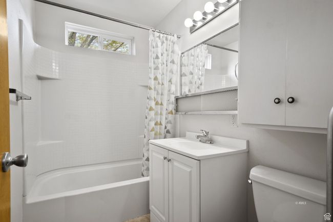 Full bathroom with vanity, toilet, and shower / tub combo | Image 19