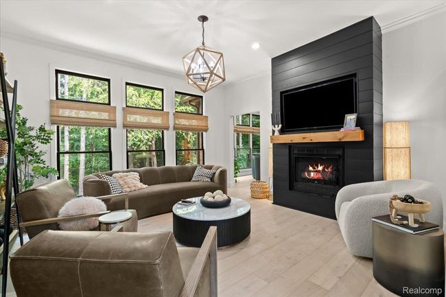 Living room with floor to ceiling windows. | Image 8