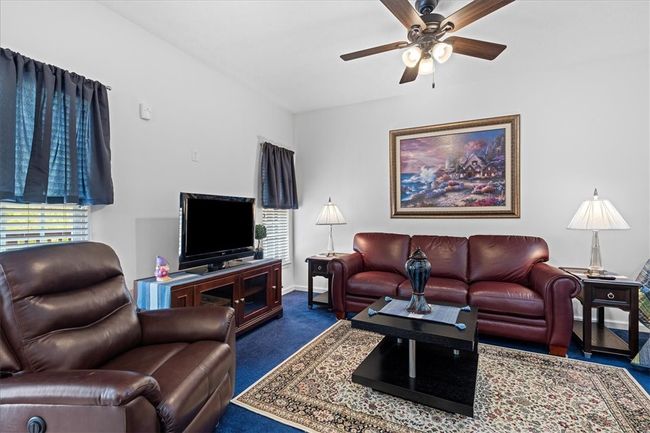 The family room is the perfect space for hanging out or movie nights. | Image 10