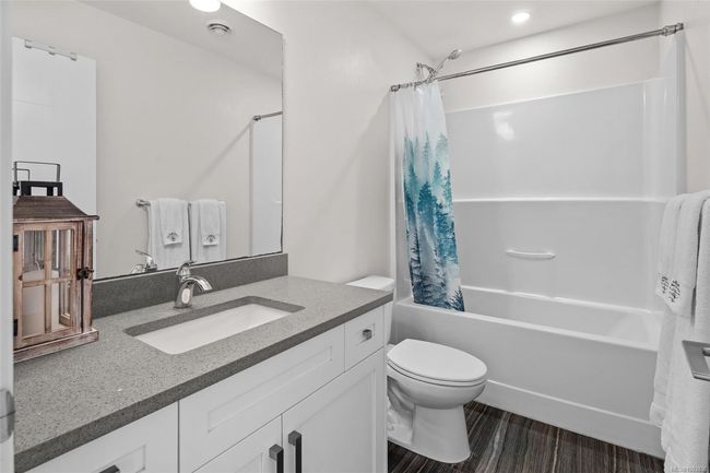 Bathroom with shower / bath combination with curtain, vanity, and recessed lighting | Image 33