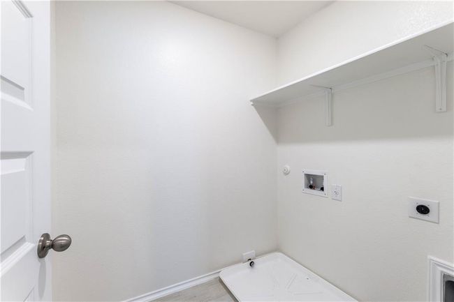 Laundry area featuring gas dryer hookup, hookup for a washing machine, and hookup for an electric dryer | Image 28