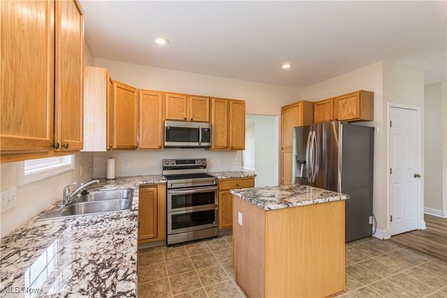 Kitchen with new counter tops and new appliances | Image 11