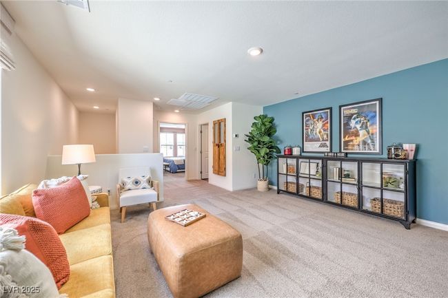 Carpeted living area with recessed lighting and baseboards. Photo is representational only; actual home finishes may vary. | Image 29