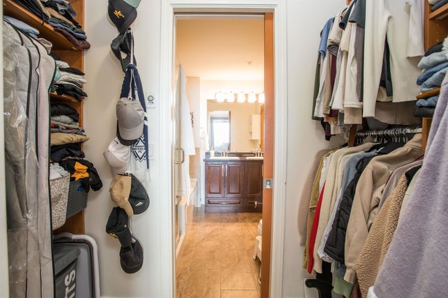 Spacious closet featuring light tile patterned floors | Image 18