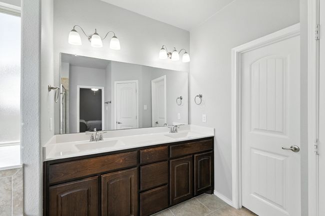 Full bathroom with double vanity and tile patterned flooring | Image 13