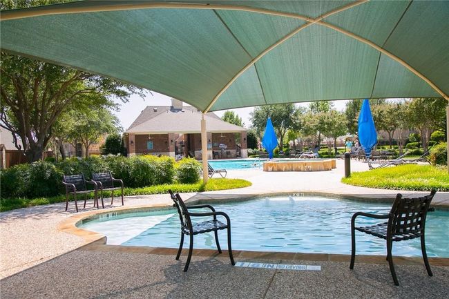 Community pool with a patio | Image 21
