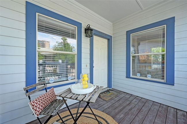 A covered front porch provides another gathering place. | Image 4