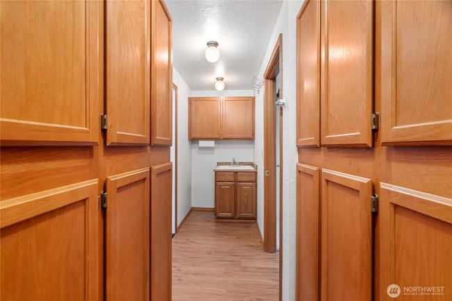 Amazing storage and utility sink in this pantry/mudroom between the two car garage and kitchen. | Image 20