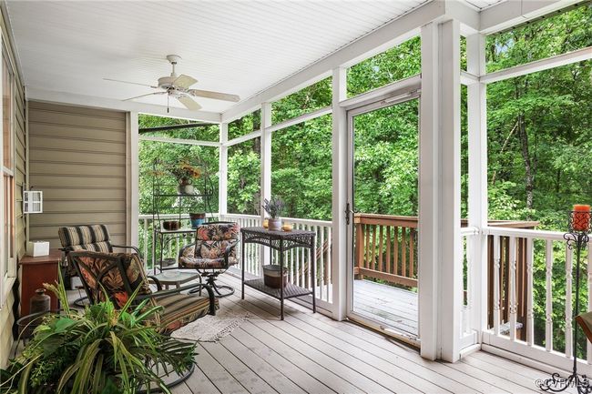 Screened porch w/ maintenance-free decking. Private rear yard. | Image 27