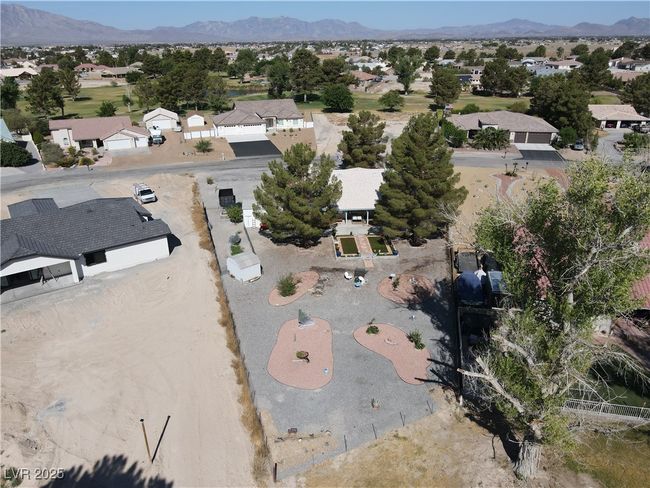 Aerial overview of property's location featuring nearby suburban area and mountains | Image 55