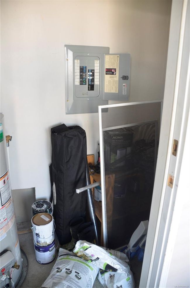 Utility room featuring gas water heater | Image 32