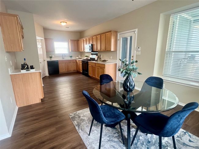 Dining room featuring dark wood-style floors and baseboards | Image 8