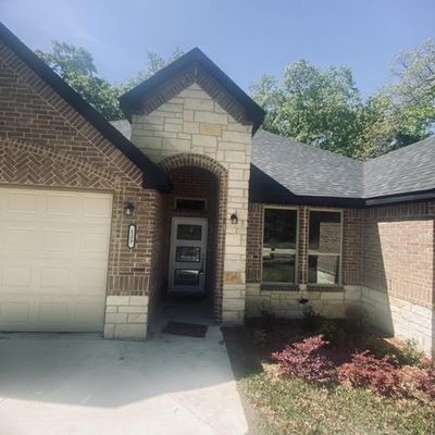 Entrance to property with a garage | Image 2